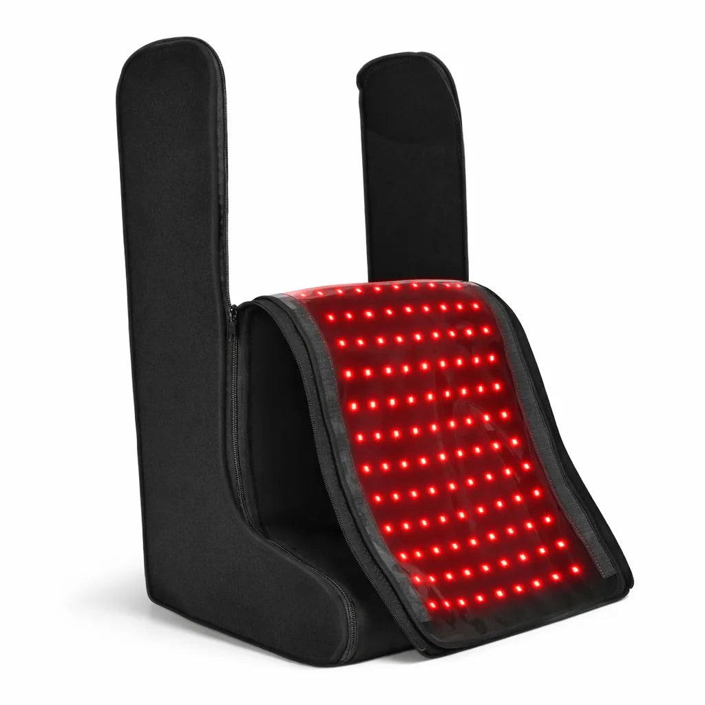 Open product shot of the black red light therapy feet and legs device with illuminated LED treatment surface on a clean background