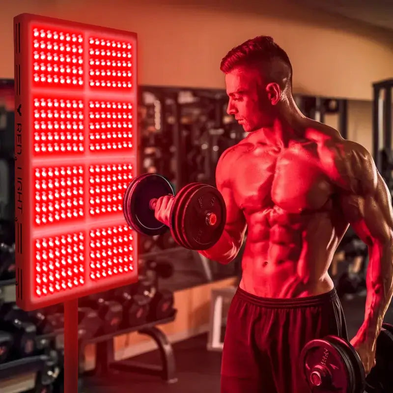 Bodybuilder using YouLumi IRP010-08T red light therapy panel for muscle recovery and performance enhancement after workout